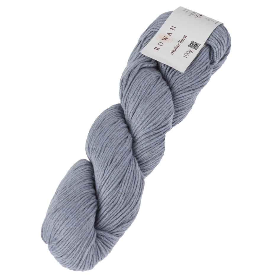 Skein of Rowan Creative Linen yarn in a light blue grey colour called Foggy