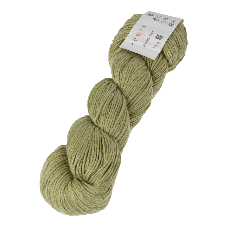 Skein of Rowan Creative Linen yarn in a pale green colour called Apple