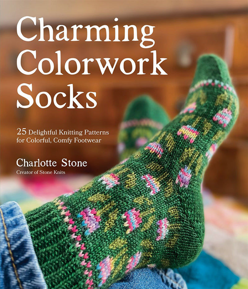 Book cover of 'Charming Colorwork Socks' with a green knitted sock on a blurred background.