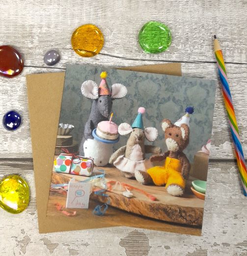 greeting card with felt mice and monkey having a birthday party.