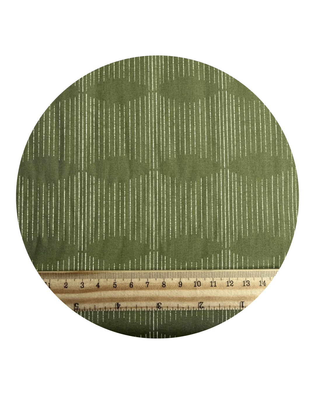 A round fabric swatch of Dream Weaver Potager from Potager Collection for Art Gallery Fabrics, with a wooden ruler in centimeters for scale, on a white background.