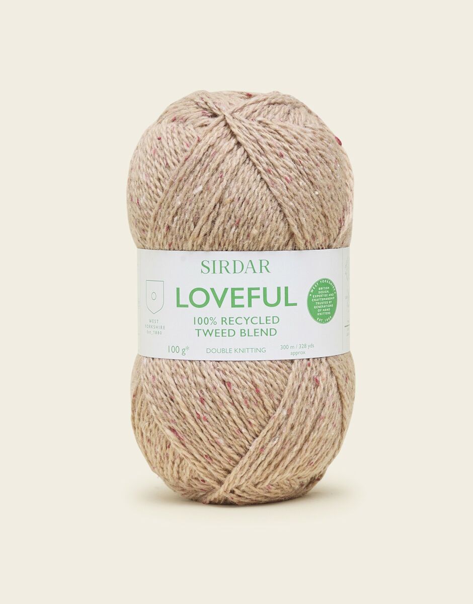 Ball of cream Sirdar Loveful yarn on a beige background