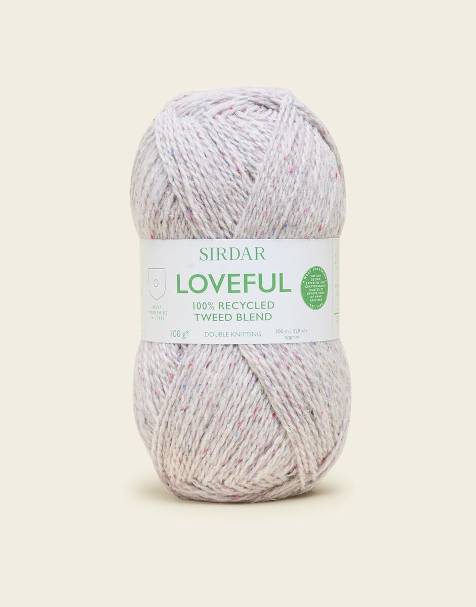 light white Sirdar Loveful yarn ball on a light beige background.