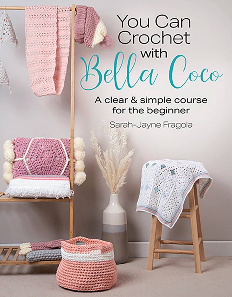 Book cover of 'You Can Crochet with Bella Coco' featuring crocheted items on a wooden rack.