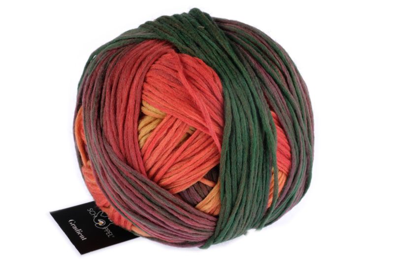 Image shows wound ball of Schoppel Gradient DK yarn. Colourway is 2479 Belladonna/Belladonna in shades of orange, blue-green and purple-brown.