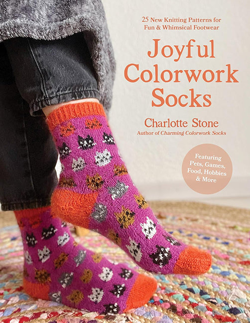 joyful colourwork socks book cover with an image of a pair of socks with cats on them.