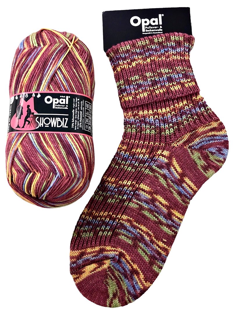 Opal Showbiz yarn ball and sock with multicolour in burgundy yellow and green pattern on a white background.