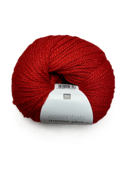 Ball of Rico Design Essentials Merino Plus DK yarn in an orange red colourway on a white background.