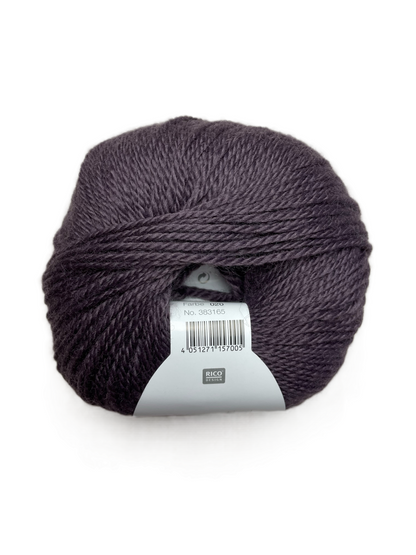 Ball of Rico Design Essentials Merino Plus DK yarn in a dusty purple colourway on a white background.