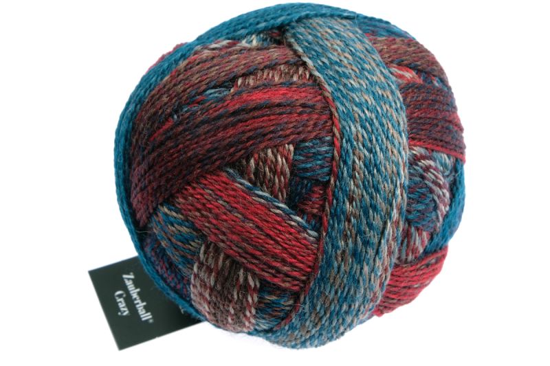 Image shows wound ball of Schoppel Zauberball Crazy 4ply/sock.  The colour is 1507 Autumn Wind/Herbstwind with shades of light to mid blue, rust and brown.