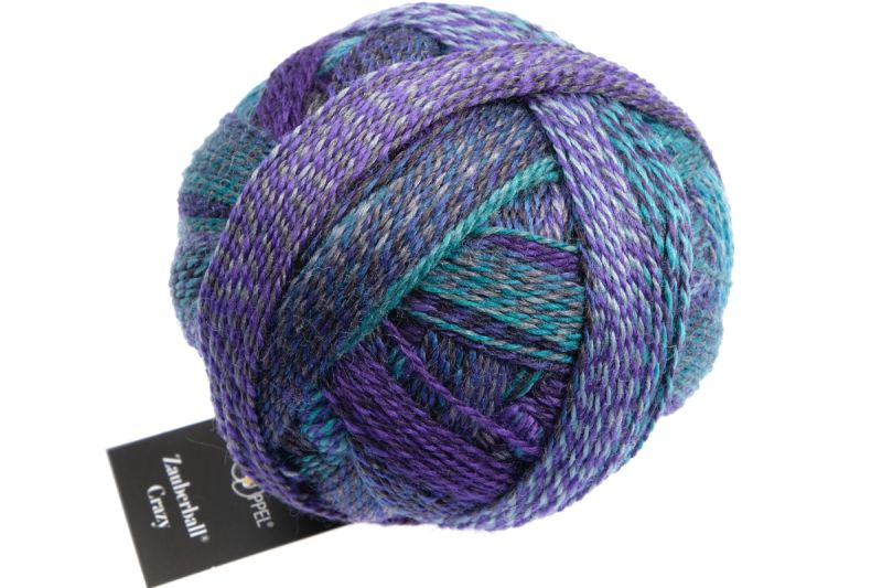 Image shows wound ball of Schoppel Zauberball Crazy 4ply/sock.  The colour is 1511 Submarine/U-boat with shades of blue, purple and brown.