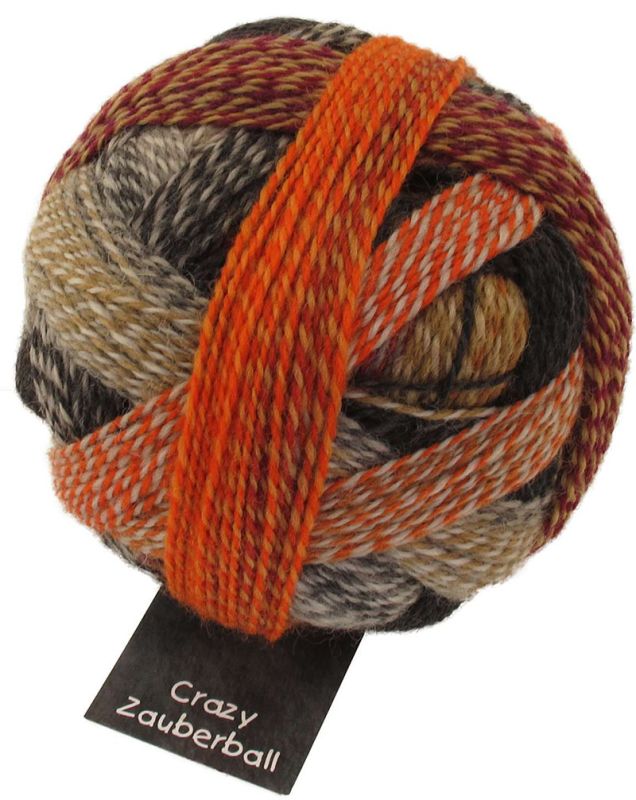 Image shows wound ball of Schoppel Zauberball Crazy 4ply/sock.  The colour is 2092 My Sweet Side/Schocoladuseite, with shades of caramel, chocolate, orange and neutrals.