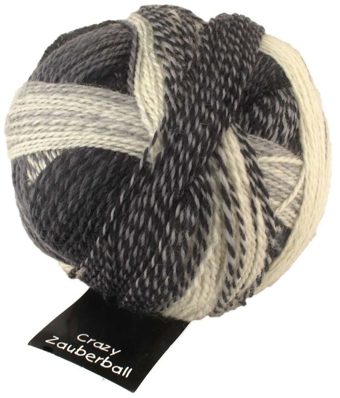 Image shows wound ball of Schoppel Zauberball Crazy 4ply/sock.  The colour is 2100 Domino, with shades of off-white, light ,medium and dark grey.