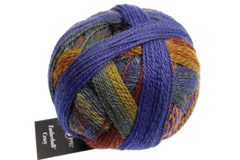 Image shows wound ball of Schoppel Zauberball Crazy 4ply/sock.  The colour is 2266 Milestone/Meilenstein with shades of royal blue, lime and chestnut.