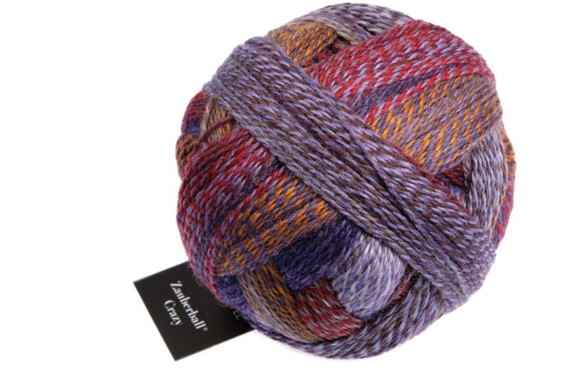Image shows wound ball of Schoppel Zauberball Crazy 4ply/sock.  The colour is 2311 Route 66, with shades of rust,grey and orange.