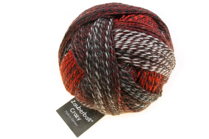 Image shows wound ball of Schoppel Zauberball Crazy 4ply/sock.  The colour is 233 with shades of brown, orange, grey and cream.
