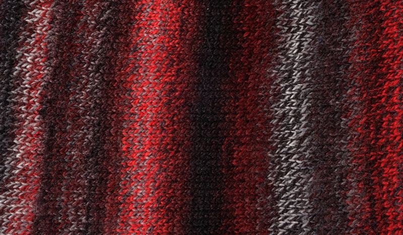 Image shows knitted swatch for Schoppel Zauberball Crazy 4ply/sock.  The colour is 233 with shades of brown, orange, grey and cream.