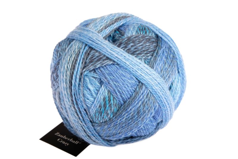 Image shows wound ball of Schoppel Zauberball Crazy 4ply/sock.  The colour is 2438 Indigo, with shades of light and dark blue and grey.