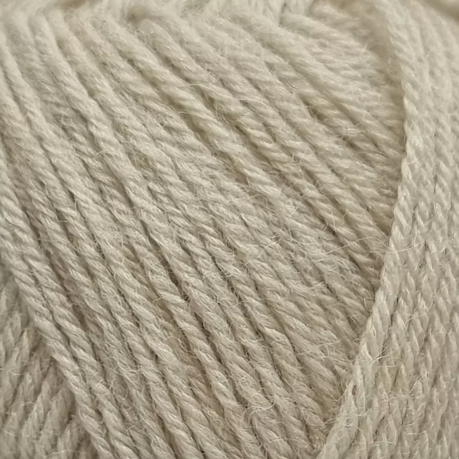 Close-up of beige yarn with visible texture.
