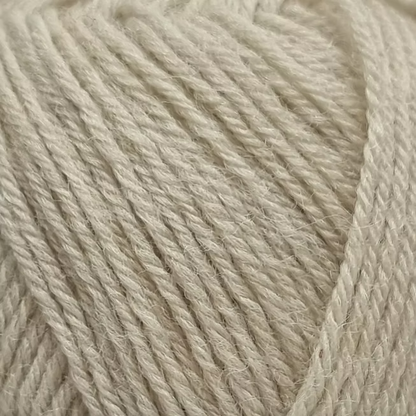 Close-up of beige yarn with visible texture.