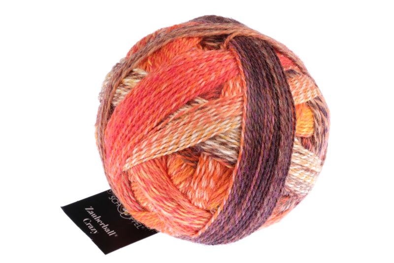 Image shows wound ball of Schoppel Zauberball Crazy 4ply/sock.  The colour is 2472 Orangery/Orangerie, with shades of peach, orange, cream and burgundy.