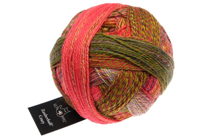 Image shows wound ball of Schoppel Zauberball Crazy 4ply/sock.  The colour is 2516 Evening Hour/Abendstunde, with shades of salmon, olive and yellow.