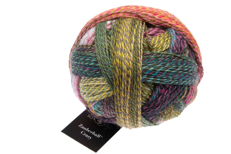 Image shows wound ball of Schoppel Zauberball Crazy 4ply/sock.  The colour is 2528 Dragon Eye/Drachenauge, with shades of blue, green, yellow and pink.