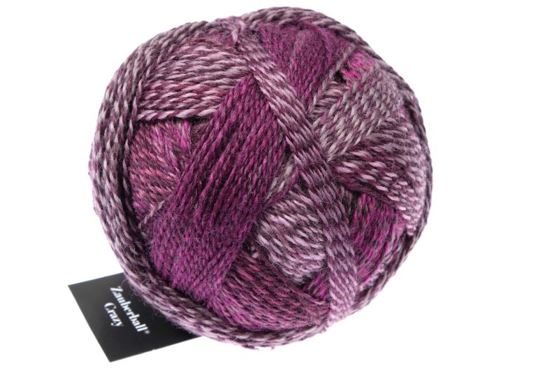 Image shows wound ball of Schoppel Zauberball Crazy 4ply/sock.  The colour is 2543 Dark Roses by Kieran Foley, with shades of mauve, pink and burgundy.