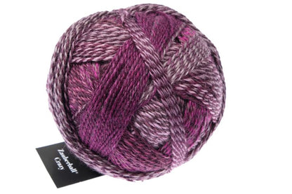 Image shows wound ball of Schoppel Zauberball Crazy 4ply/sock.  The colour is 2543 Dark Roses by Kieran Foley, with shades of mauve, pink and burgundy.