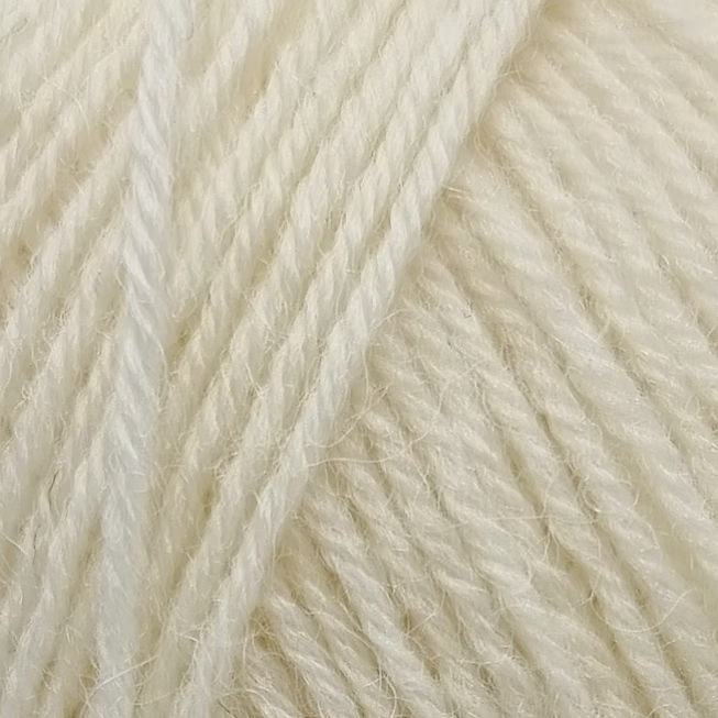 Close-up of cream-colored yarn strands