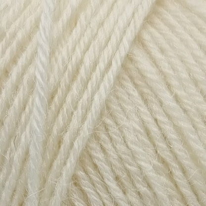 Close-up of cream-colored yarn strands