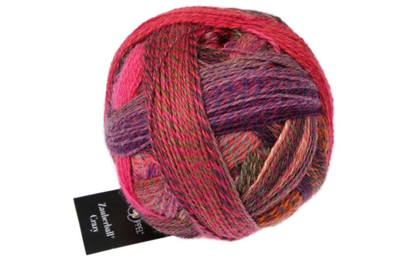 Image shows wound ball of Schoppel Zauberball Crazy 4ply/sock.  The colour is 2631 Italian Sunset, with shades of pink, purple and olive green