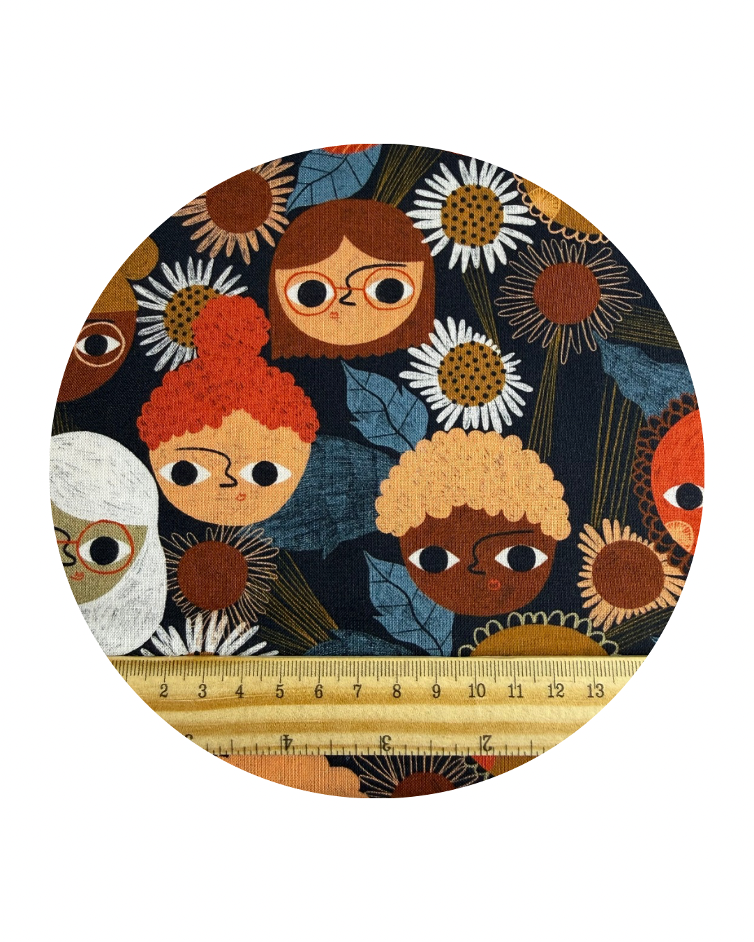 A  round swatch of Budding Ideas from Idea Garden collection for Cloud9 Fabrics, on a white background and a wooden ruler in centimeteres fro scale at the bottom.