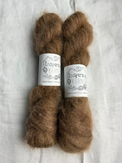 two skeins of a tonal light brown mohair with inspiring yarns label on white background.