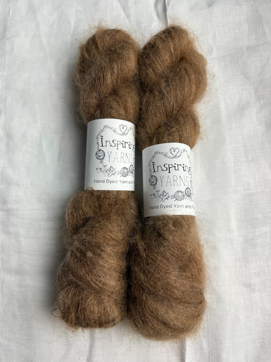two skeins of a tonal light brown mohair with inspiring yarns label on white background.