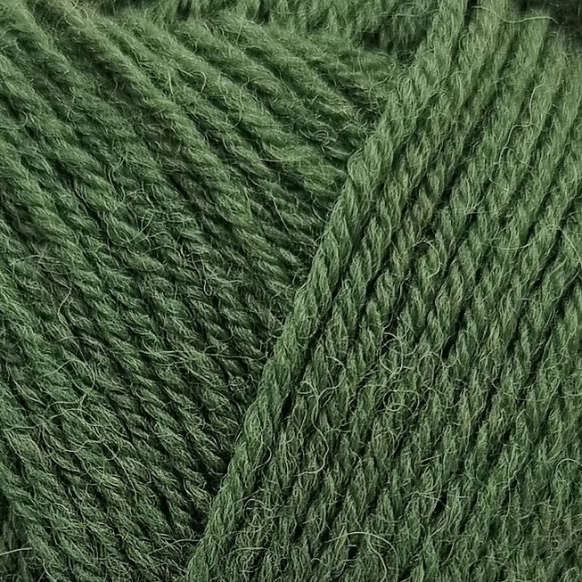Close-up of green yarn with a textured surface.  