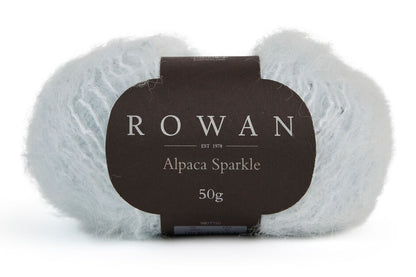 ball of rowan alpaca sparkle with black rowan label with grey writing on plain white background.