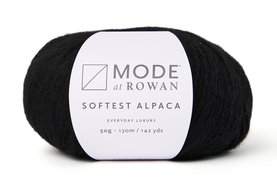 ball of black yarn with a mode at rowan label on a white background.