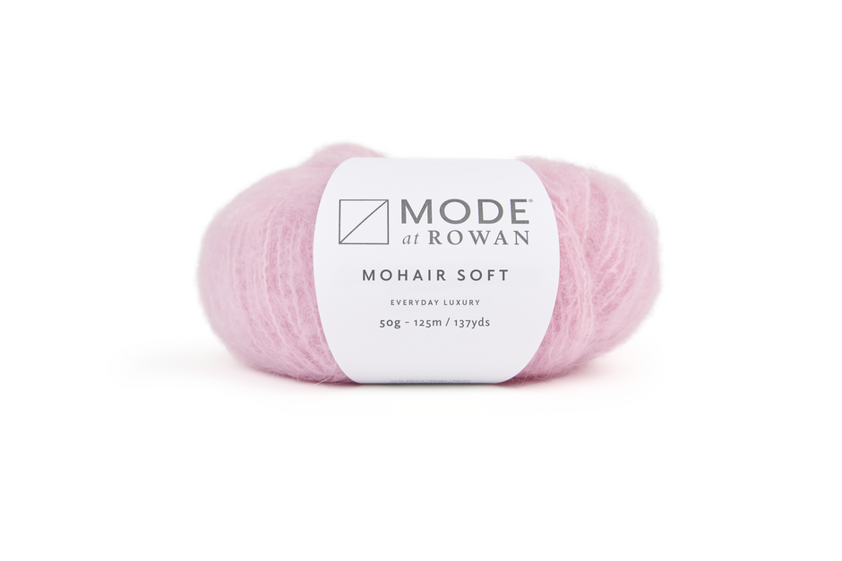 ball of light pink ball of yarn with mode at rowan label on plain white background.