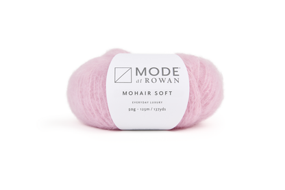 ball of light pink ball of yarn with mode at rowan label on plain white background.
