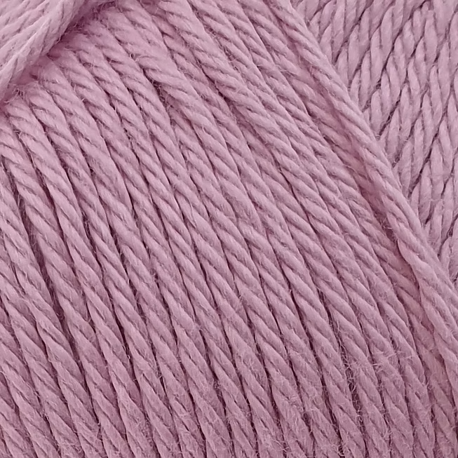 close up of light pink cotton yarn ball.