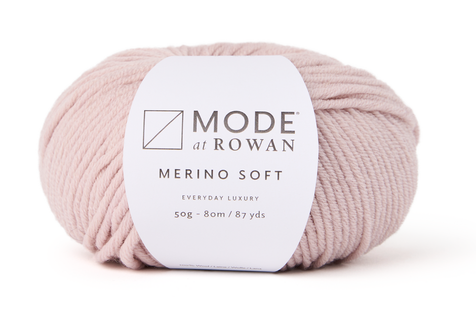 ball of light pink yarn with mode at rowan label with grey writing on plain white background.