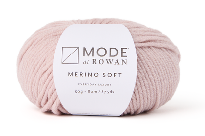 ball of light pink yarn with mode at rowan label with grey writing on plain white background.