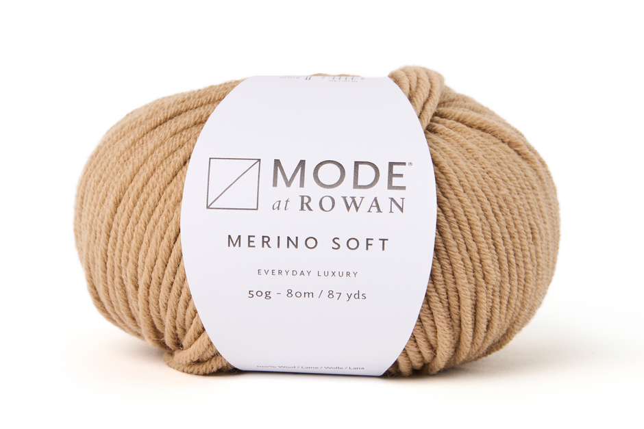 ball of beige yarn with mode at rowan label with grey writing on a plain white background.