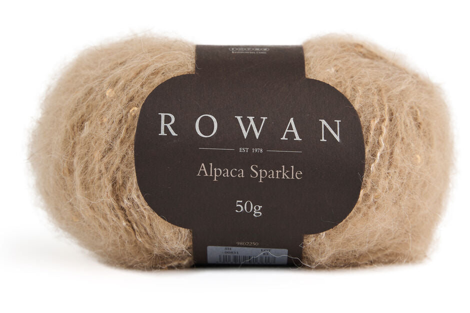 Ball of brown neutral brown sparkle yarn with black rowan label and grey writing.