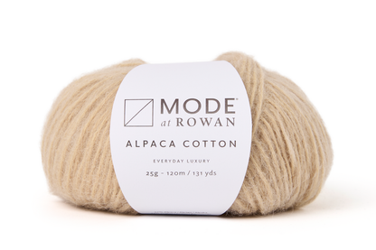 beige ball of yarn with white mode at rowan label with grey writing on a plain  white background.