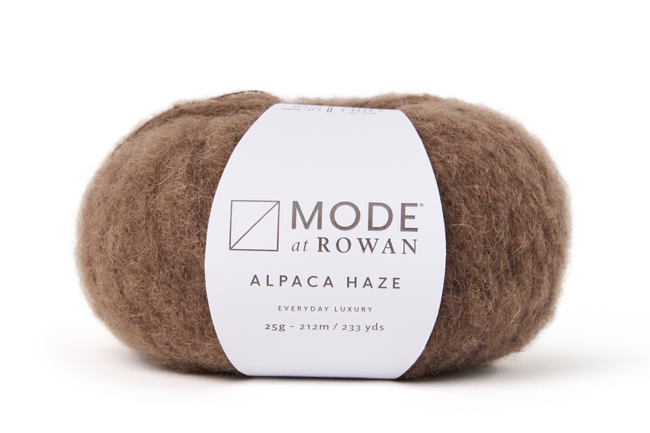 ball of brown fluffy yarn on a white background with mode at rowan label and grey writing.