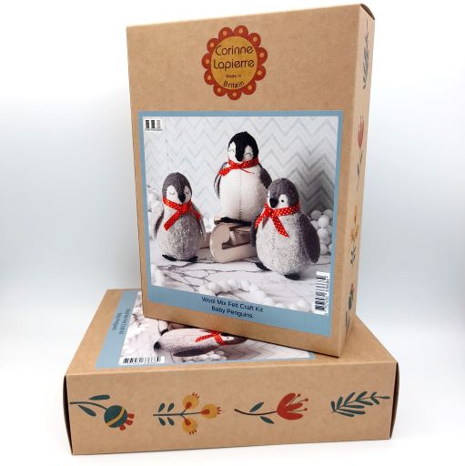 Cardboard box with a picture of penguin craft kit on a white background