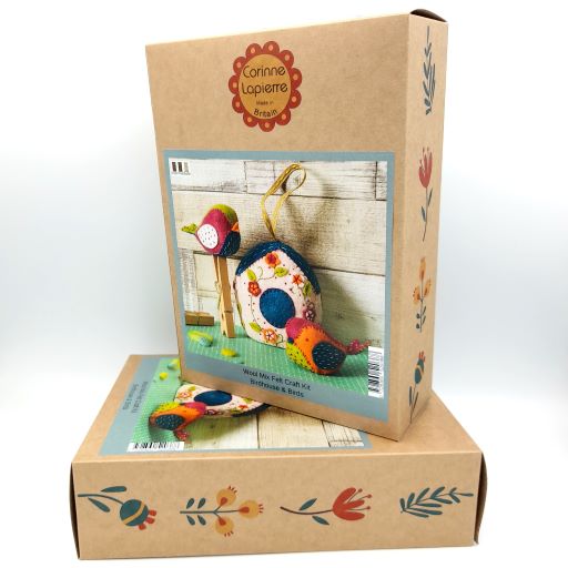 Craft kit packaging with colorful bird design on a cardboard box