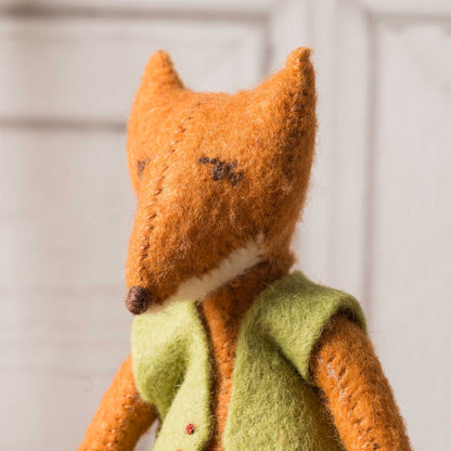 up close of the foxes face with dainty features and wool felt. 